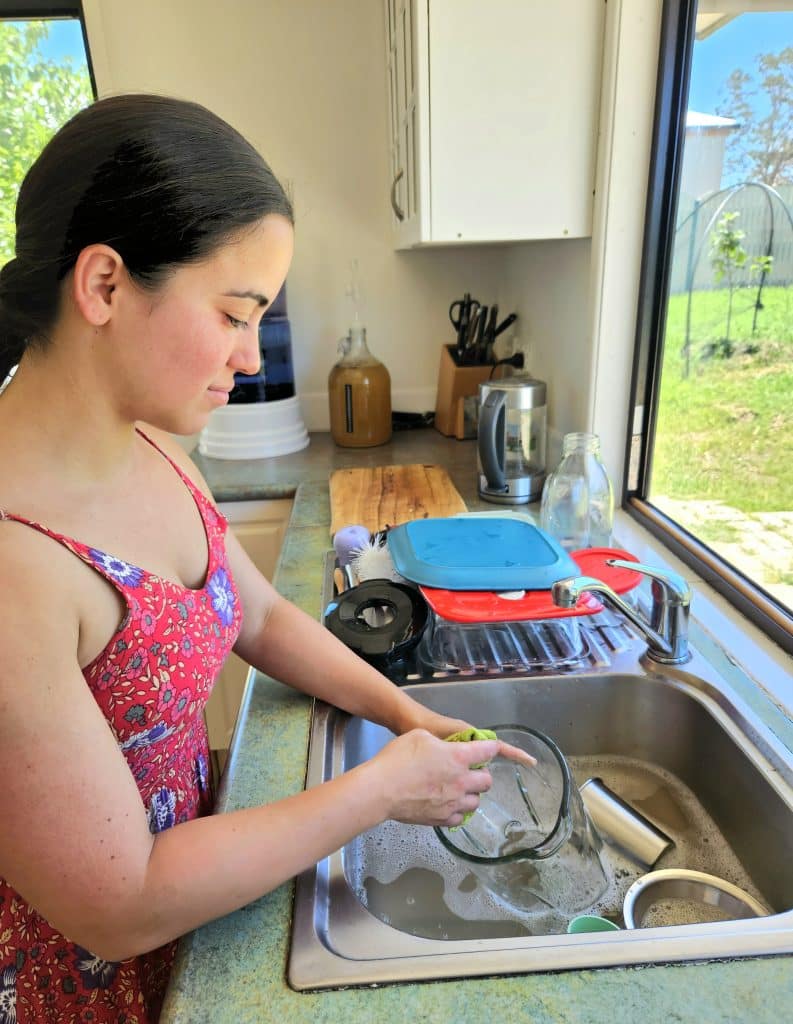 Wife cleaning dishes. Stay at home mom