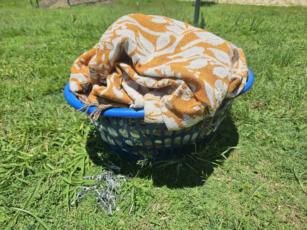 Laundry basket with laundry outside on the grass. Stay at home mom. 