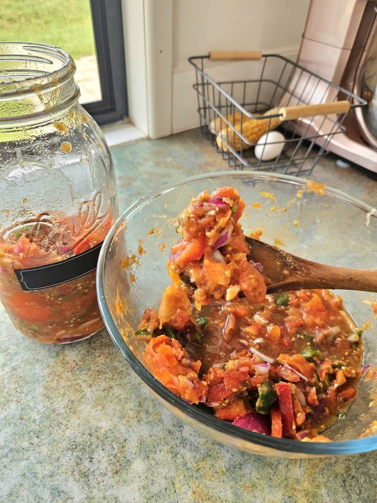 Mixing up ingredients for fermented salsa.