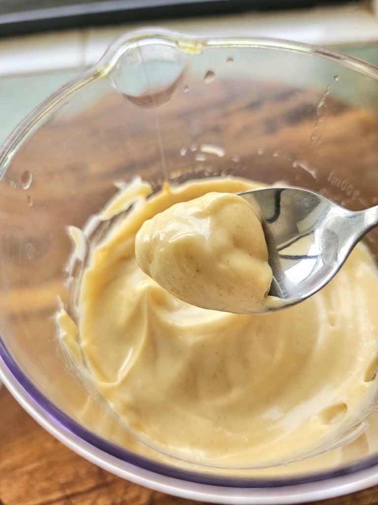 Homemade Mayonnaise in a spoon.