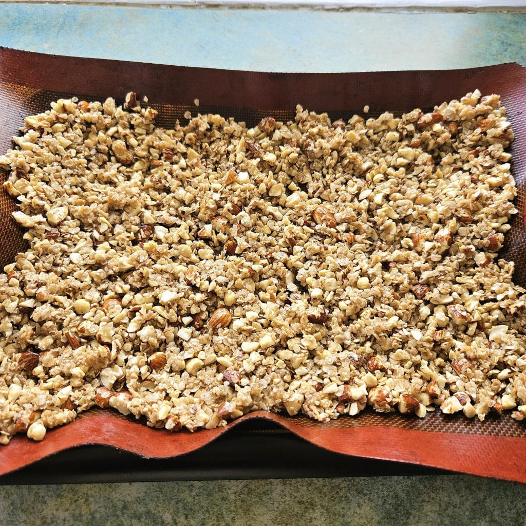 Homemade granola ready to bake in the oven. 