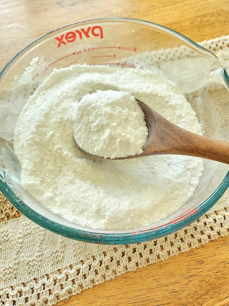 Mixing all the ingredients together for natural laundry detergent.