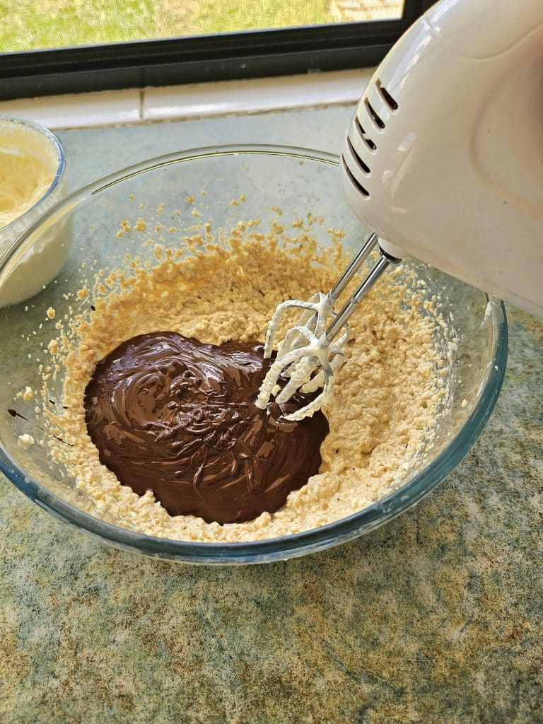 Mixing dark chocolate into kefir cheesecake mix. 