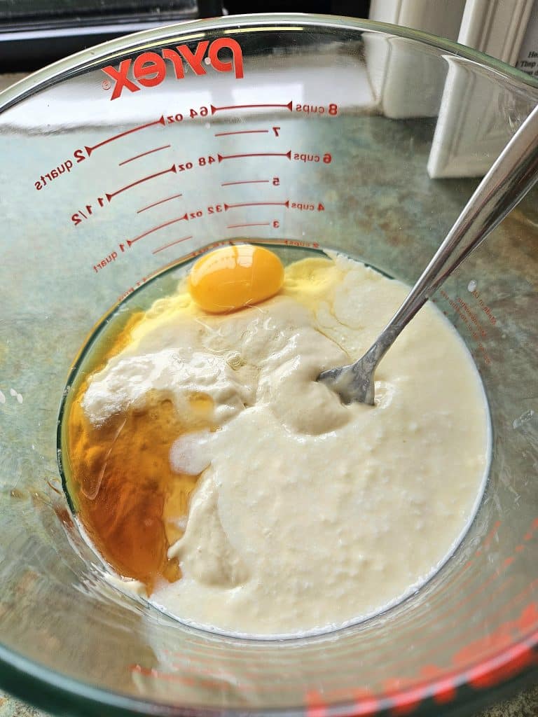 Sourdough pancake ingredients in a bowl.