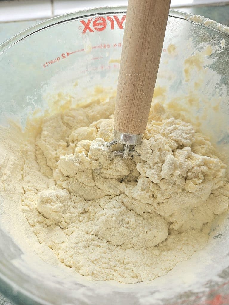 mixing ingredients for sourdough bagel recipe.