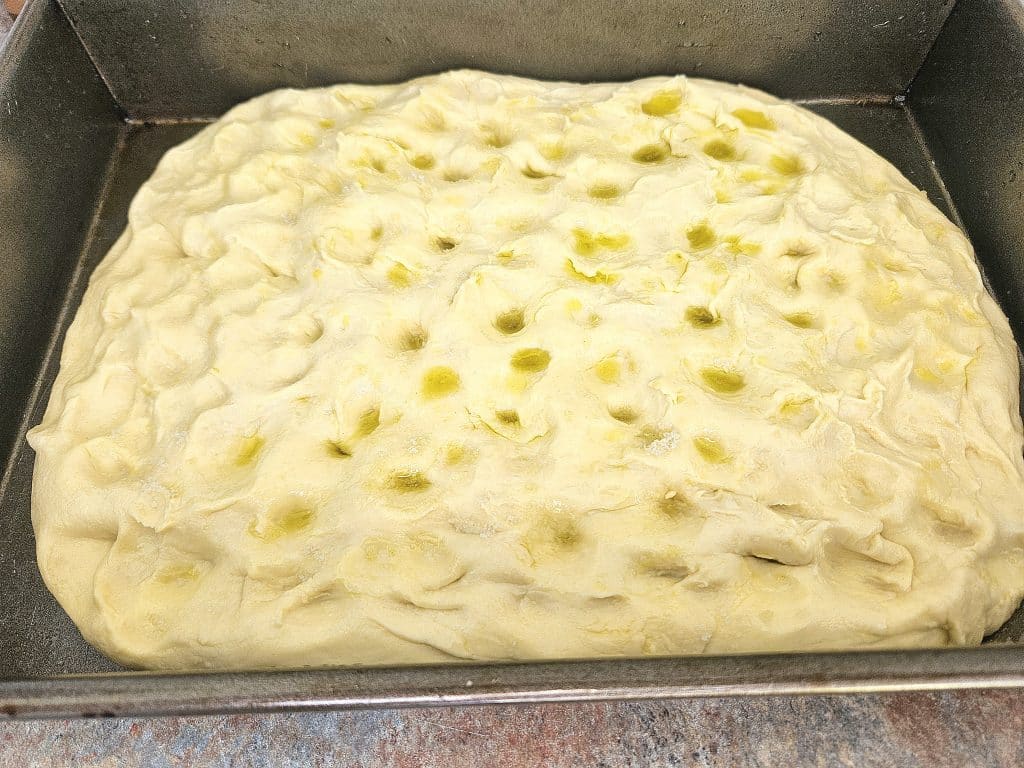 Dimpling Sourdough focaccia.