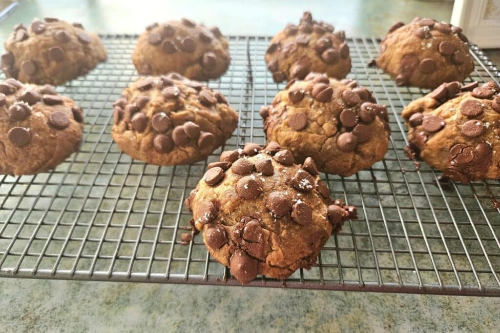 s'more cookies resting on a baking tray.