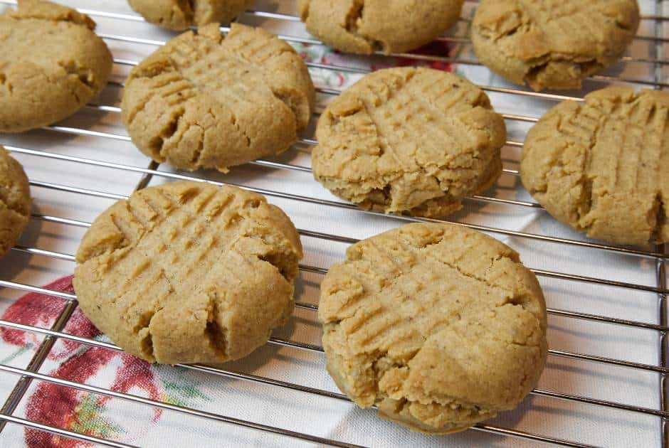 Soft dairy free peanut butter cookies on a cooling rack.