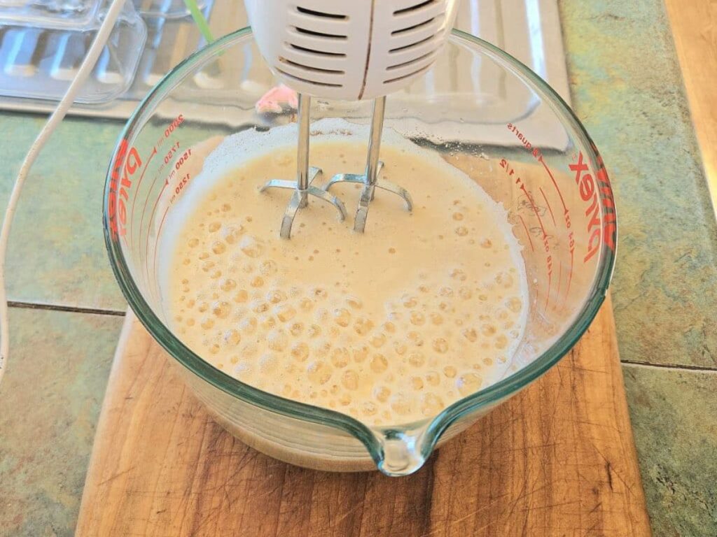 Mixing egg whites and sweetener for marshmallows.