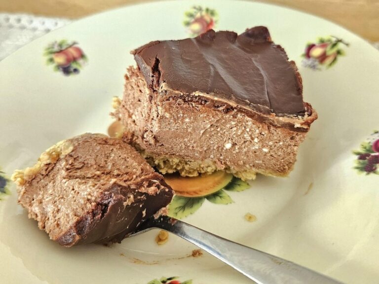 Slice of chocolate cheesecake in a bowl.