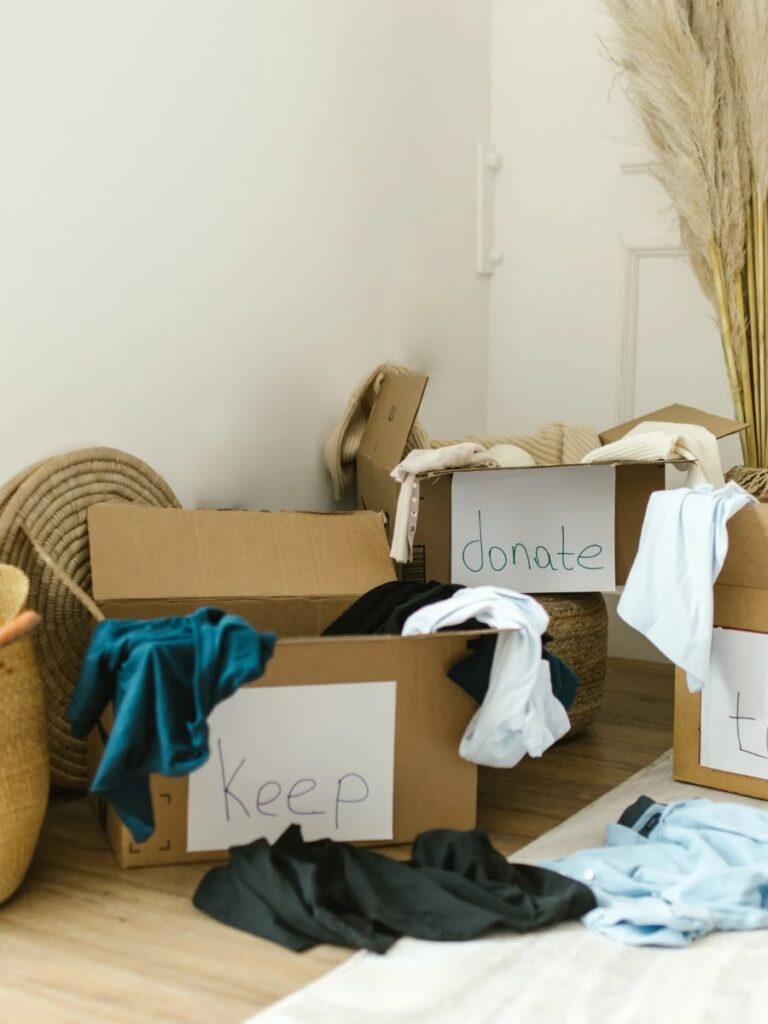 Boxes on the floor being used to declutter the home.