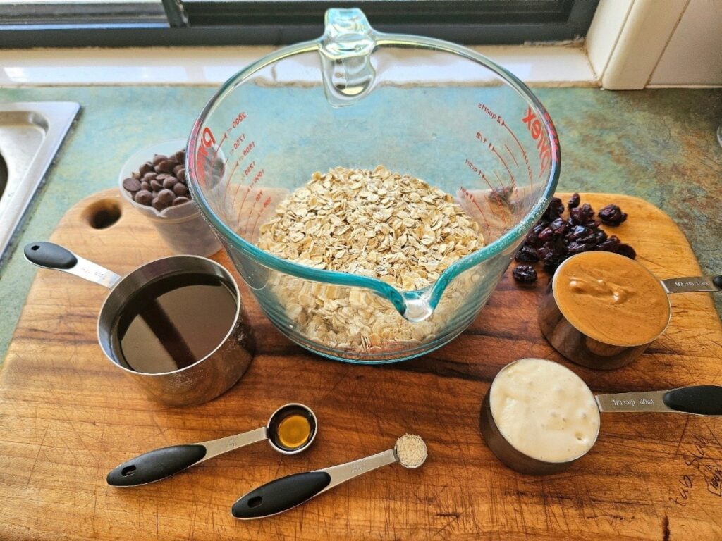 Granola bar ingredients displayed on a cutting board.