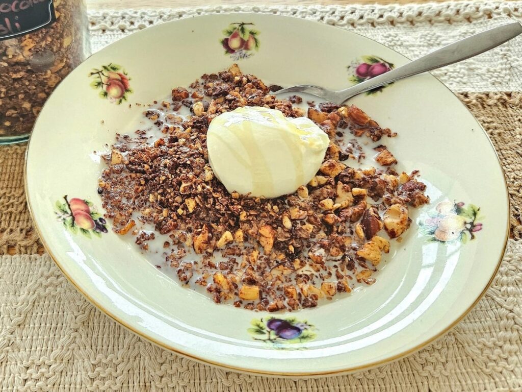 Healthy granola in a bowl with milk and yoghurt.