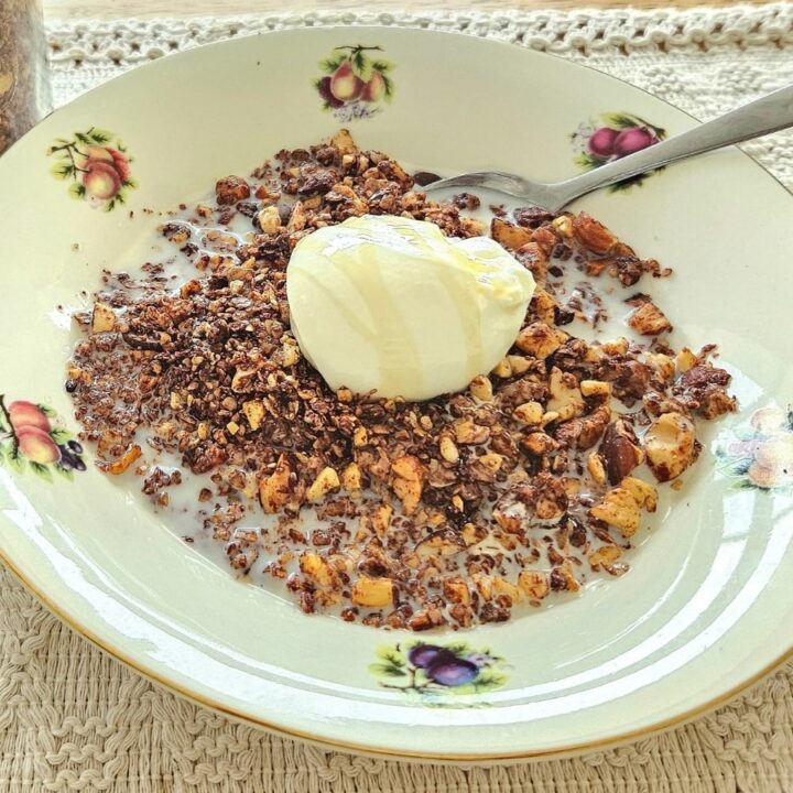 Healthy granola in a bowl with milk and yoghurt.