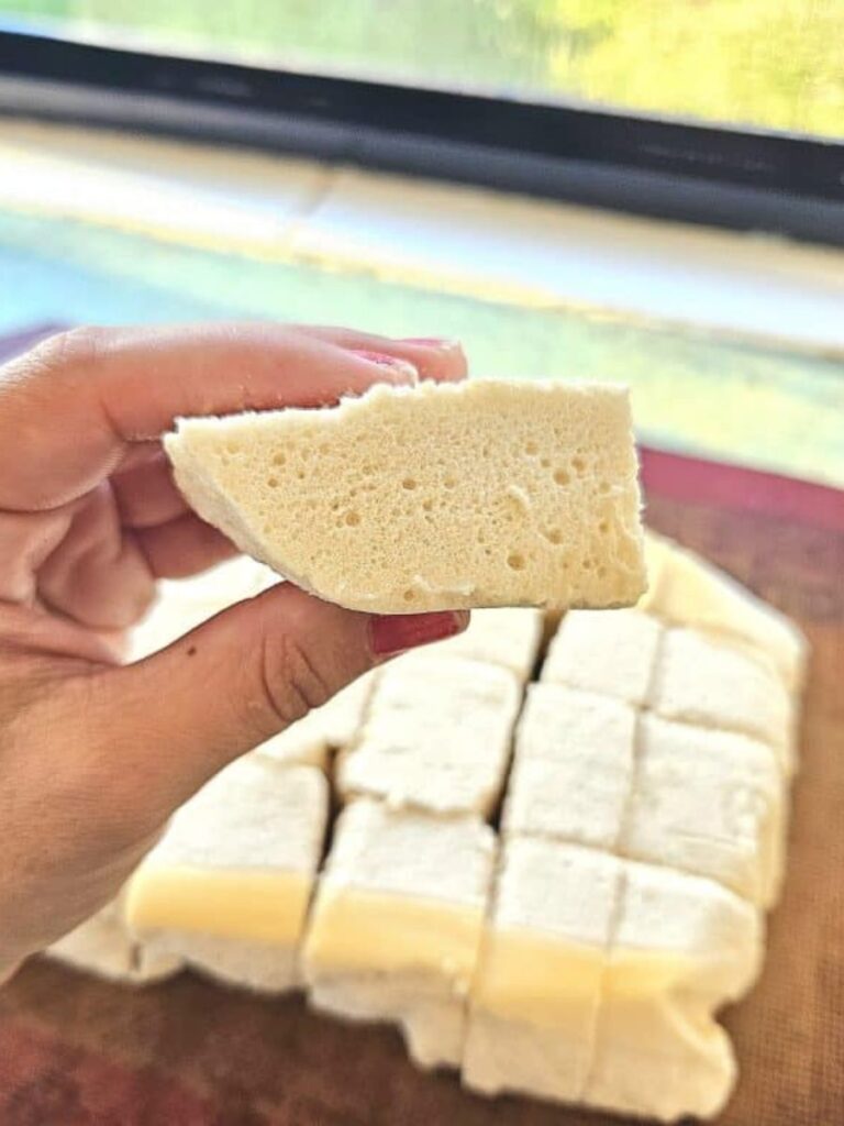 Holding a fluffy homemade healthy marshmallow.