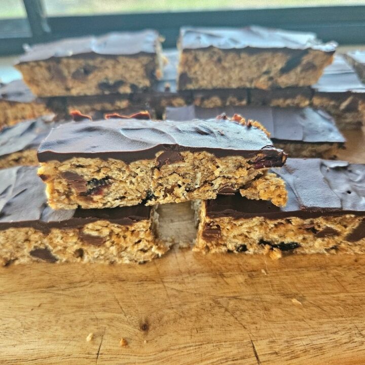 homemade granola bars topped with dark chocolate.