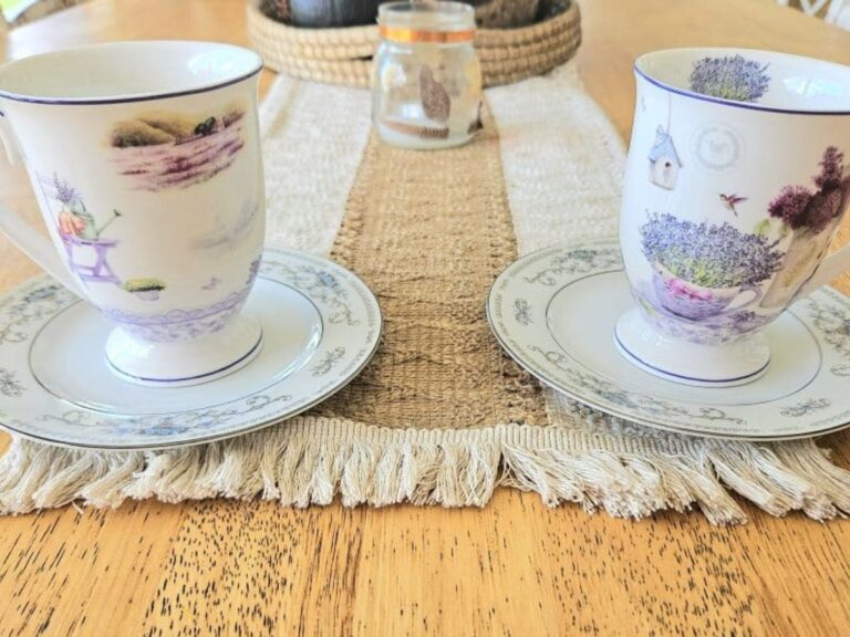 Two cups of tea on a table.