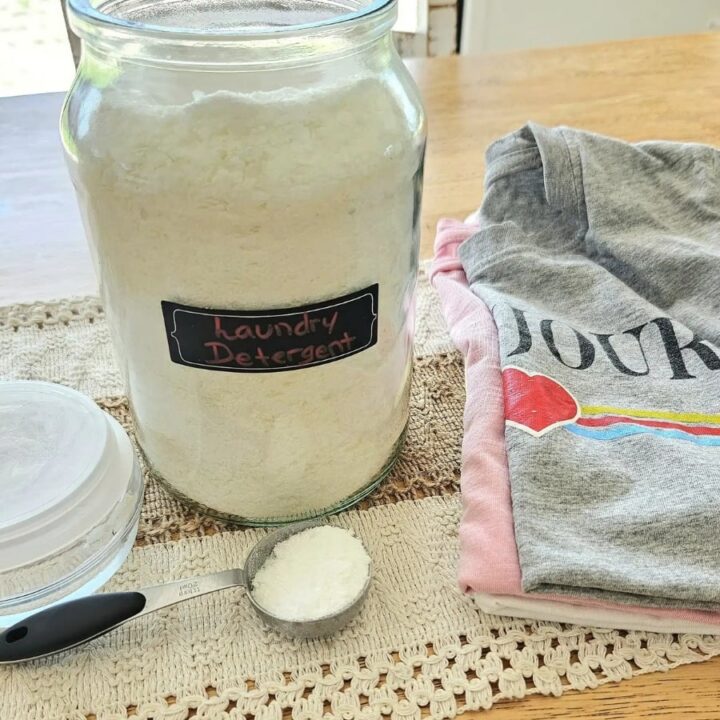 Laundry powder on a table with clothes.