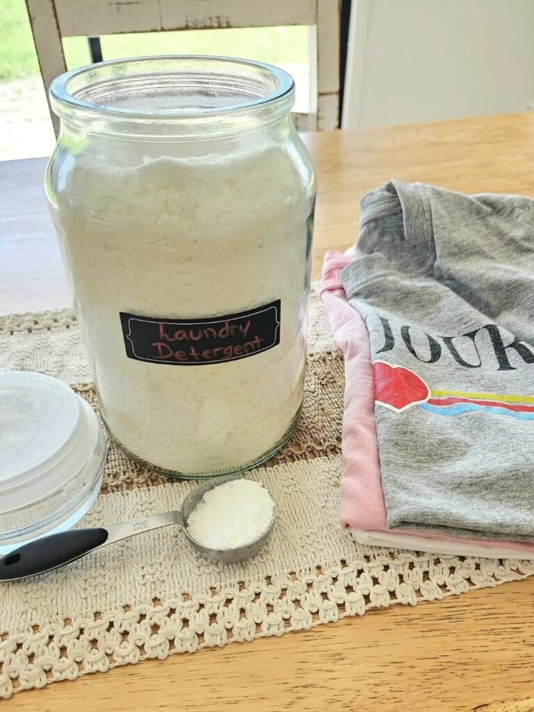 Laundry powder on a table with clothes.