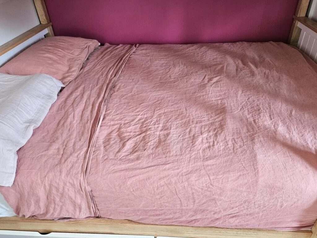 Natural pink linen sheets.