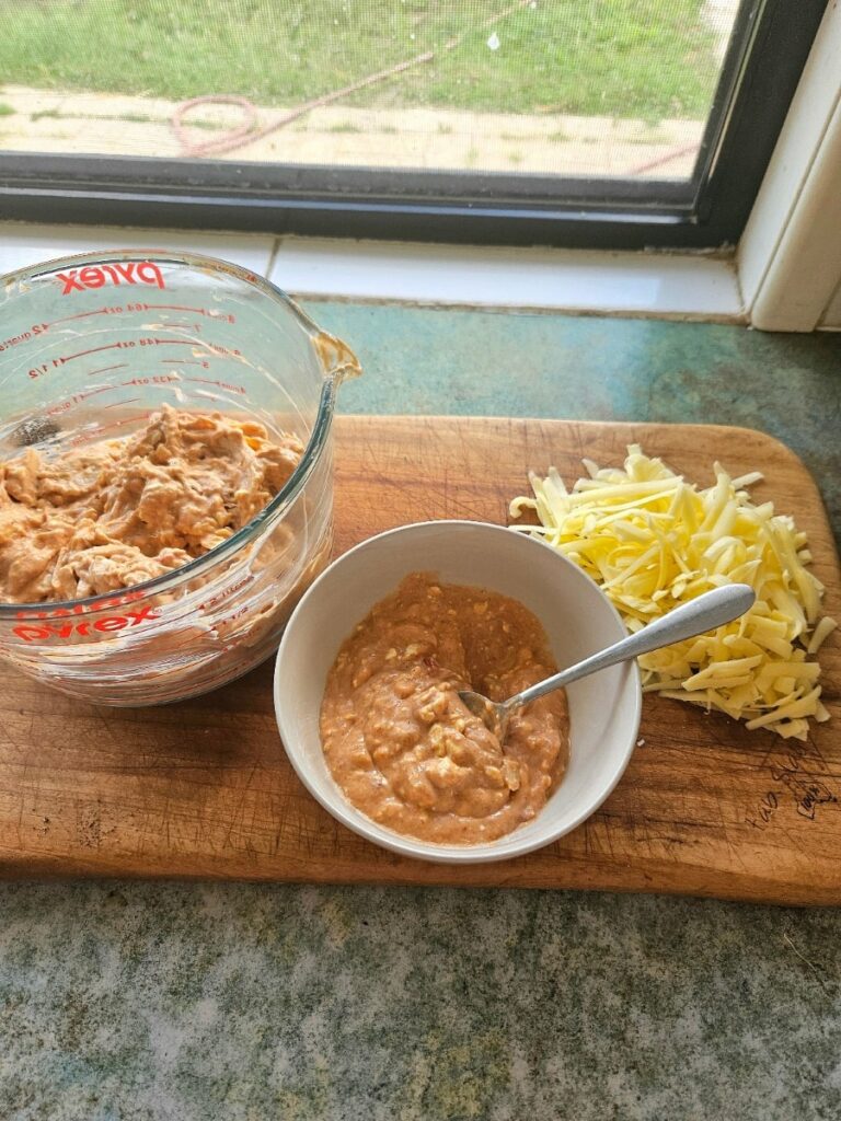 Making homemade chicken enchiladas.