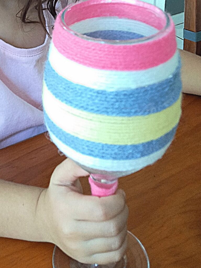 Passover craft cup with yarn.