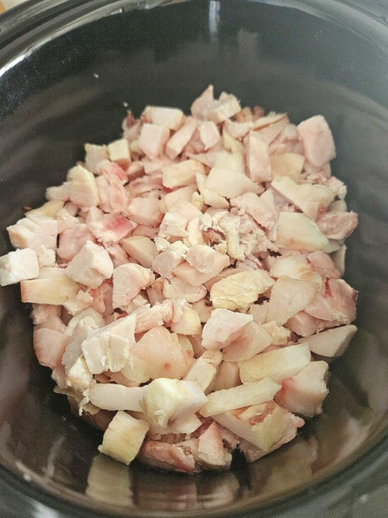 Diced fat in a slow cooker.