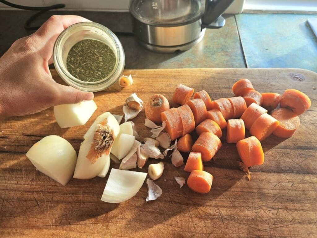 Bone broth ingredients on a cutting board.