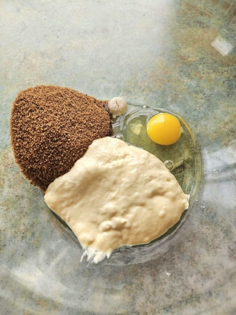 Sourdough cinnamon roll ingredients in a bowl.