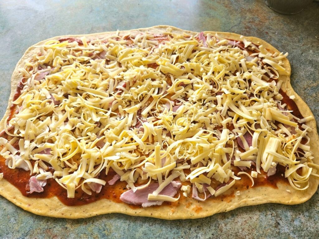 Sourdough pizza dough filled with ham, cheese and sauce.