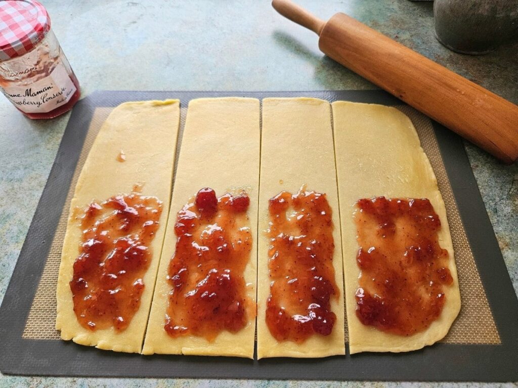 Filling sourdough pop tarts with jam.