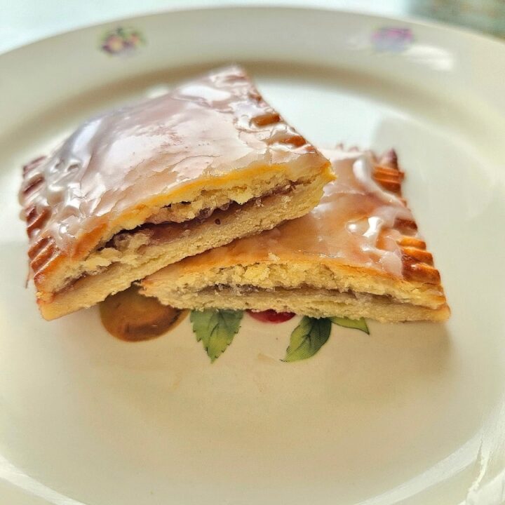 Sourdough discard pop tarts cut in half on a plate.