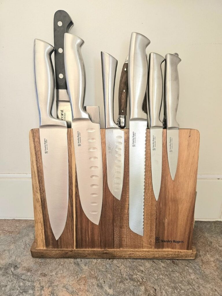 Sharp knives on a magnetic board.