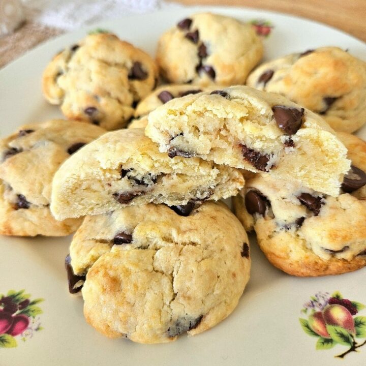 Soft and fluffy sourdough chocolate chip cookies on a plate.