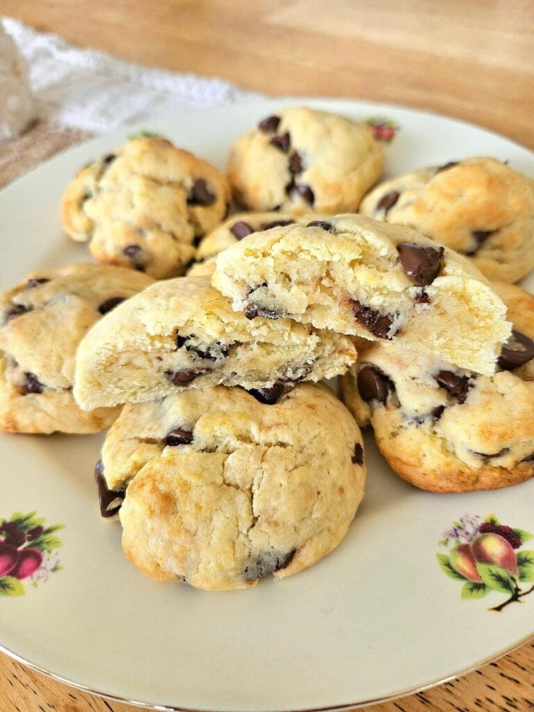 Soft and fluffy sourdough chocolate chip cookies on a plate.