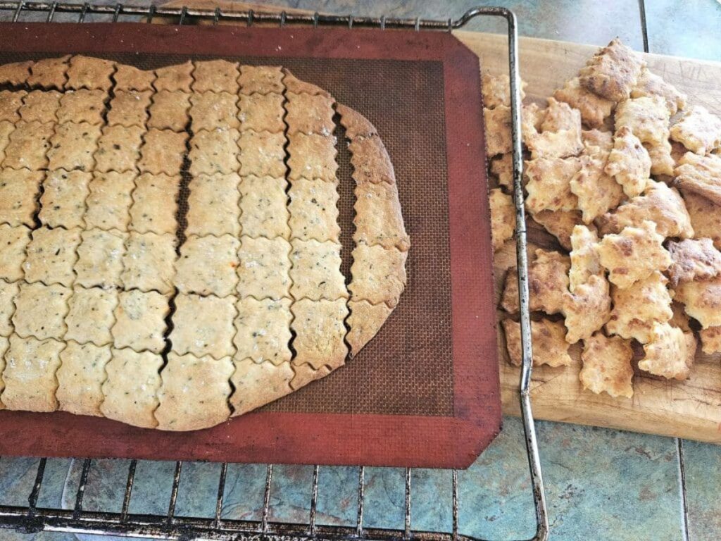 Sourdough crackers right out of the oven on a silicone mat.