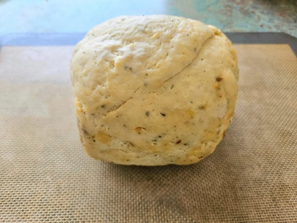 Sourdough pizza dough fermenting on counter.