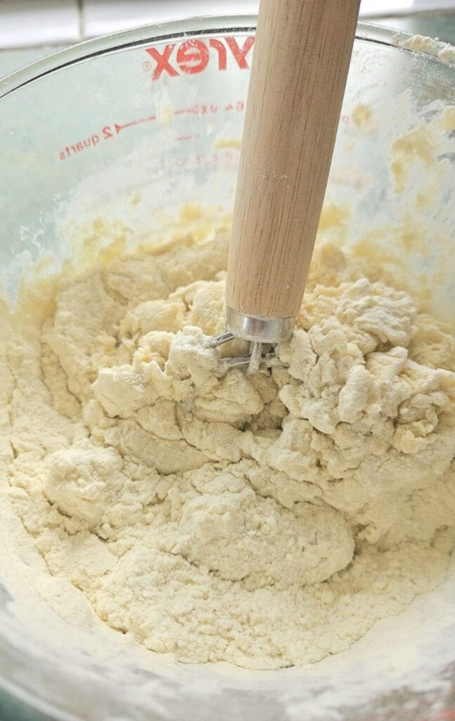 Mixing sourdough bagel dough.