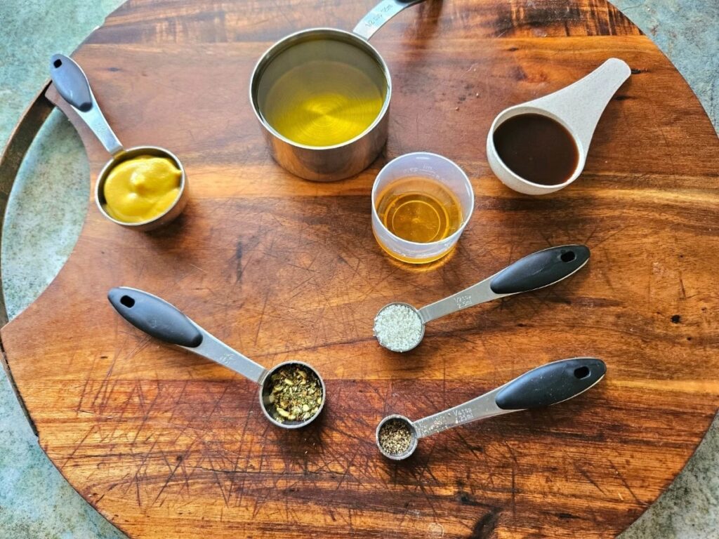 Balsamic vinegrette ingredients on a cutting board.