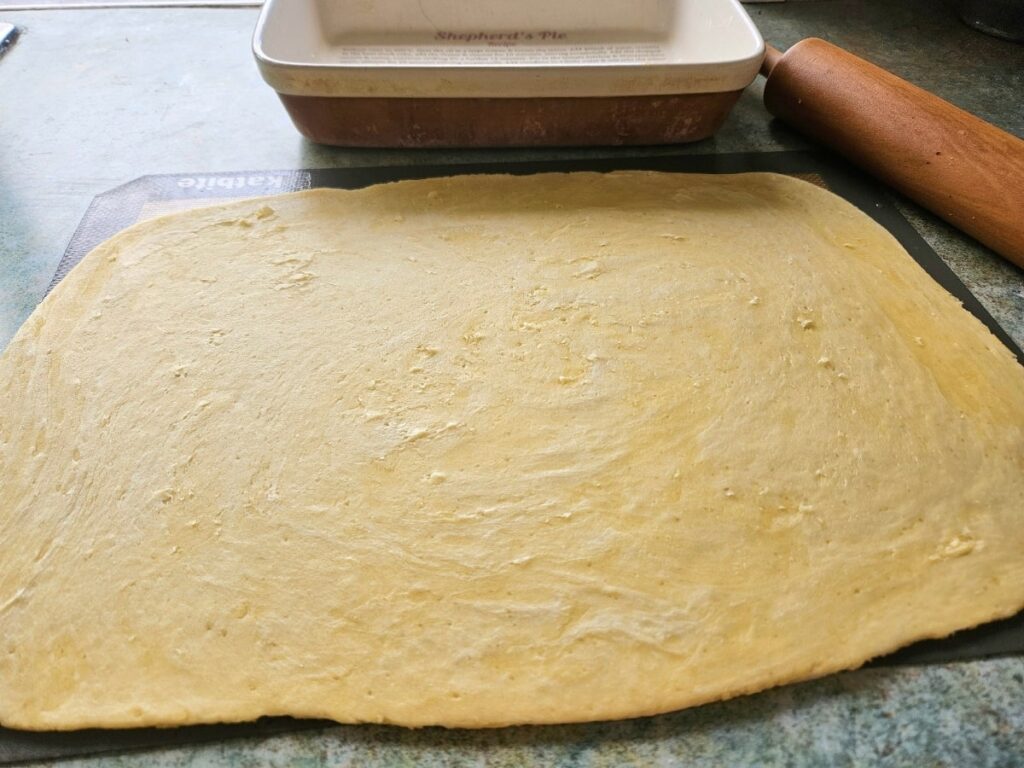 Sourdough pie crust rolled out and ready to be placed into baking dish.