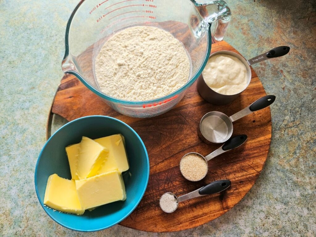 Sourdough pie crust ingredients on a cutting board in the kitchen.