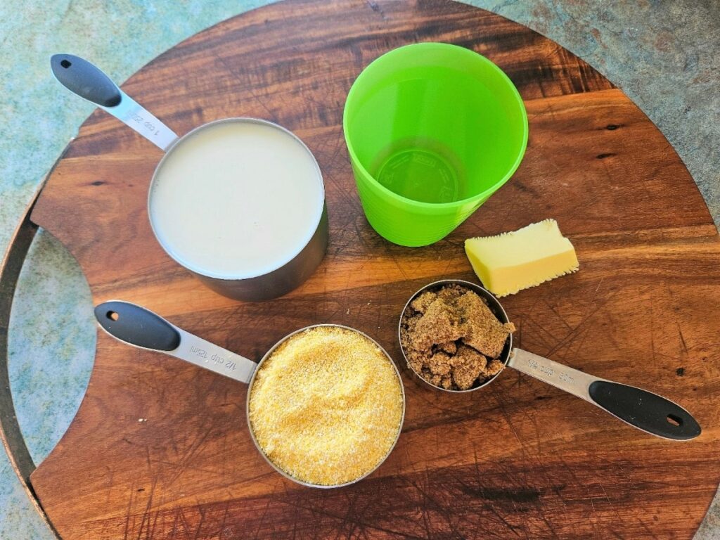Creamy cornmeal ingredients displayed on a cutting board.
