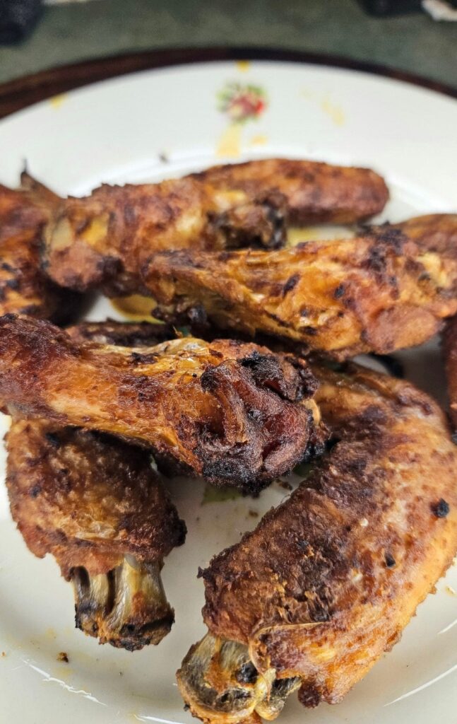 Crispy chicken wings on a plate.