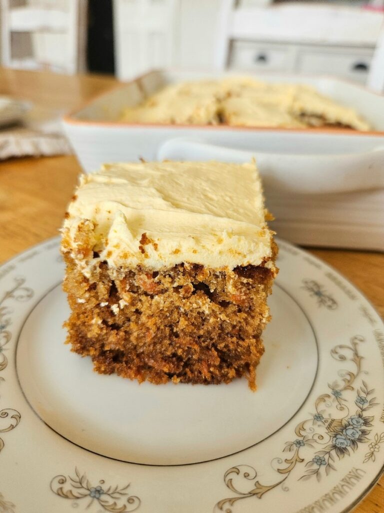 Slice of carrot cake on a plate.