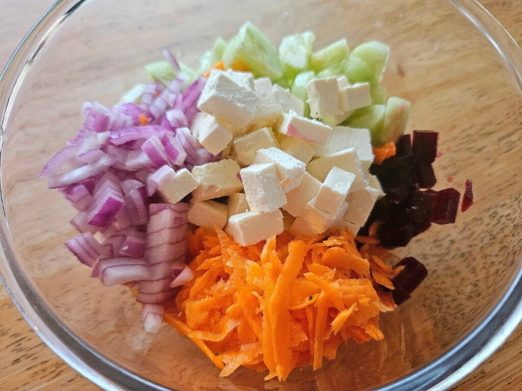 Mediterrenean salad mixture in a bowl.