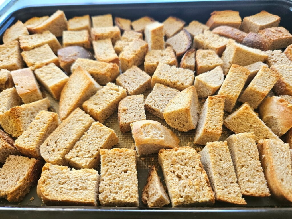 Toasted bread pieces ready to be turned into breadcrumbs.