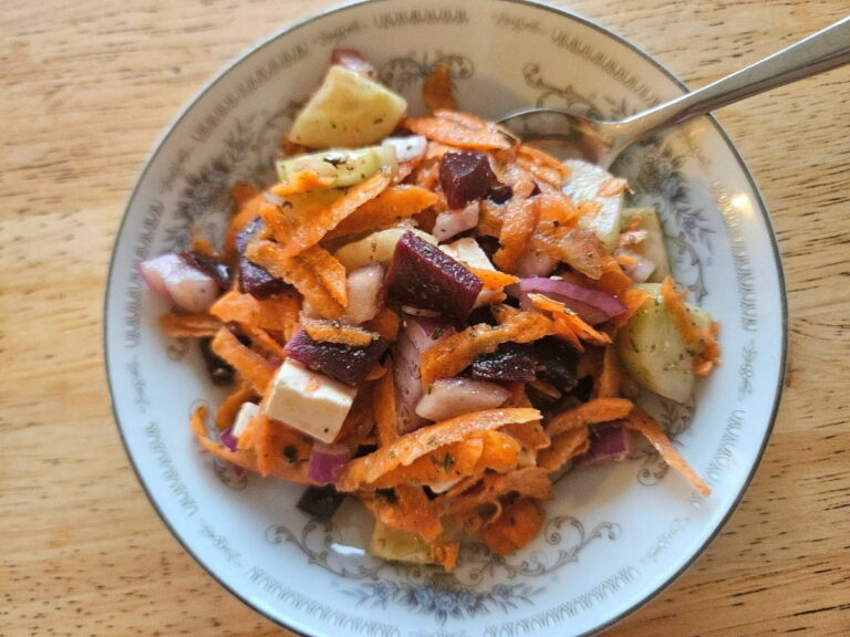 Mediterranean salad served on a plate on a table.