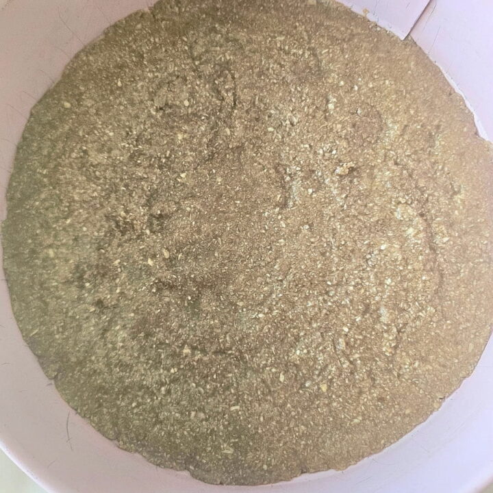 Oat pie crust in a cake pan.