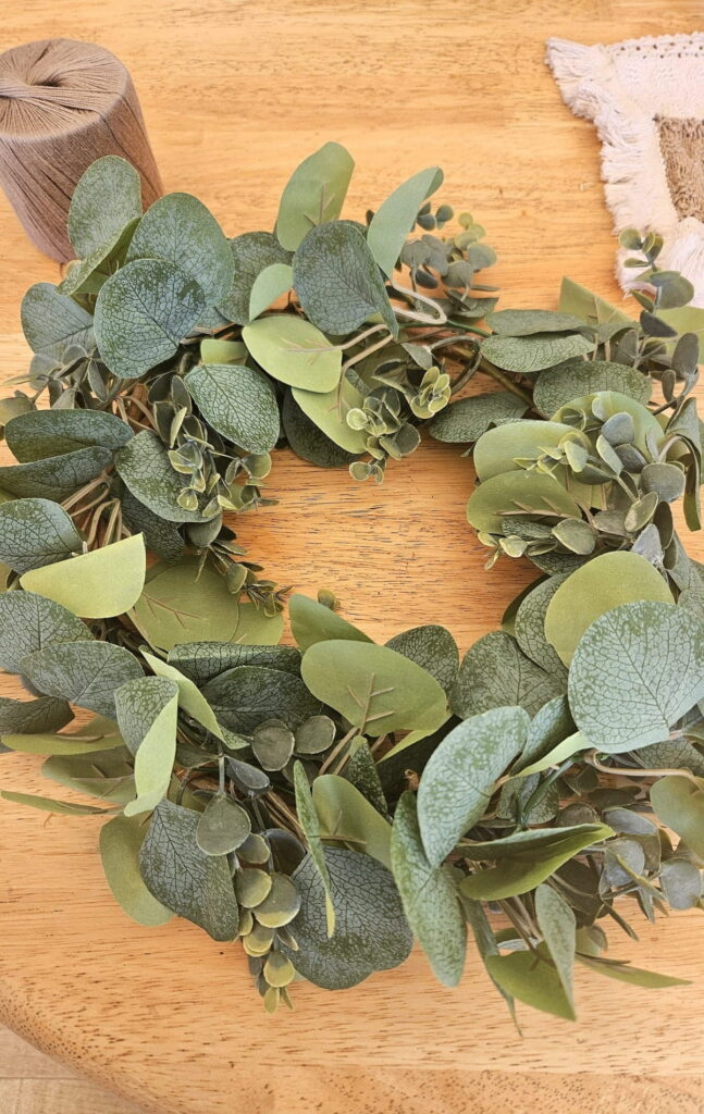 Homemade wreath on a table.